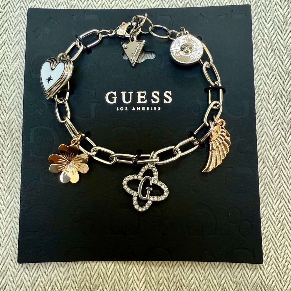 GUESS Gold and Silver Charm Bracelet with Heart and Wing